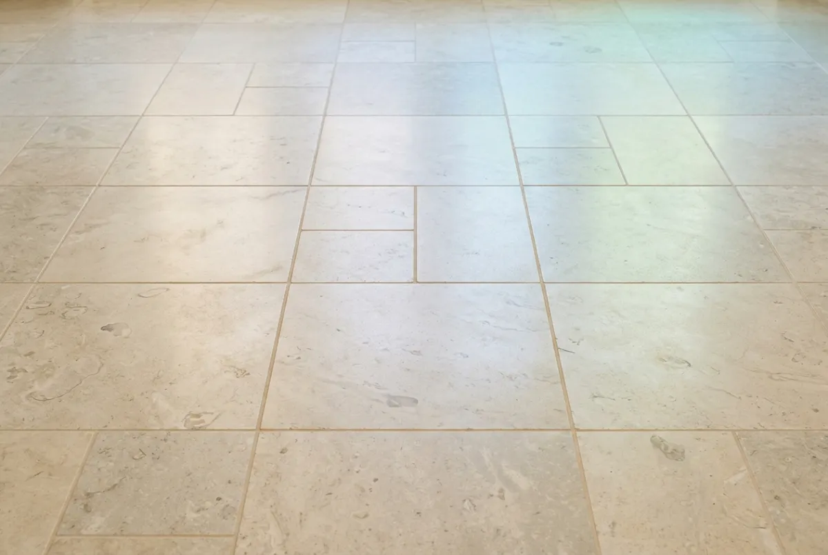 Impeccable restored limestone floor with uniform natural finish