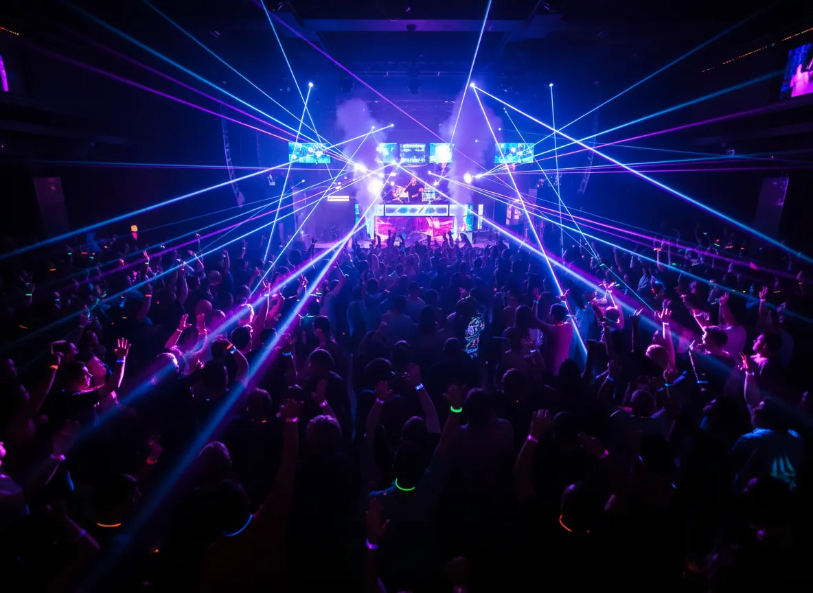 Crowded nightclub with lasers and DJ