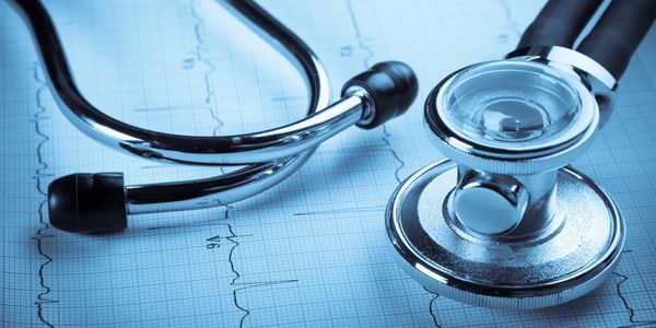 Stethoscope on blue background