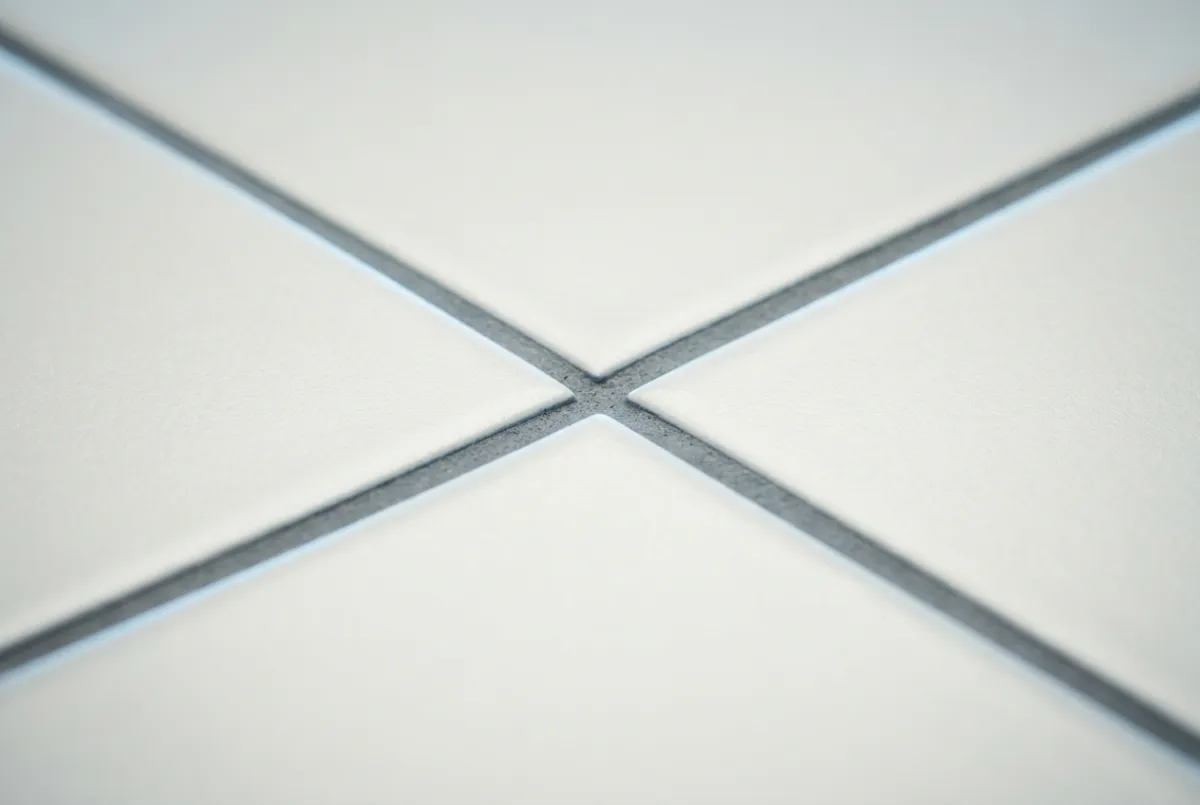 Clinical macro view of spotless bathroom grout and ceramic tiles
