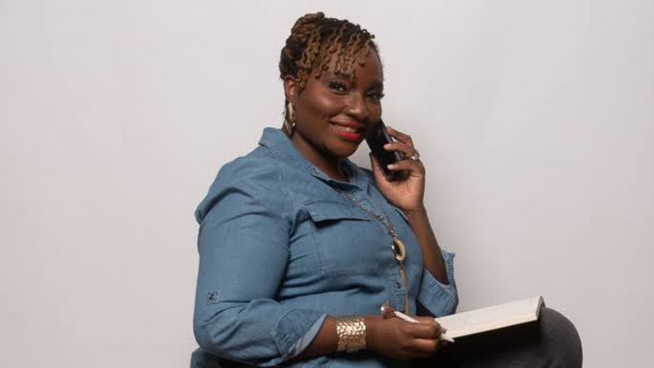 Woman looking at notebook on a call
