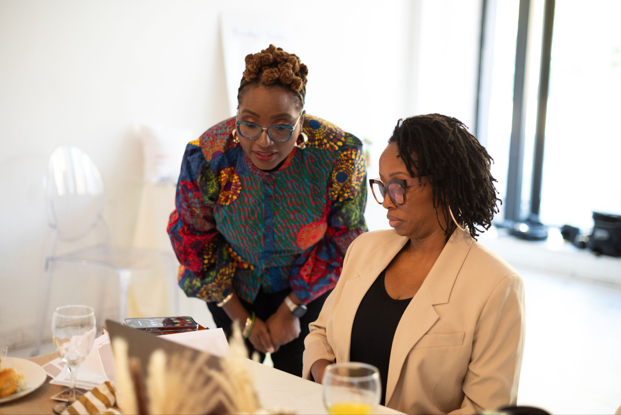 Women working together collaboratively
