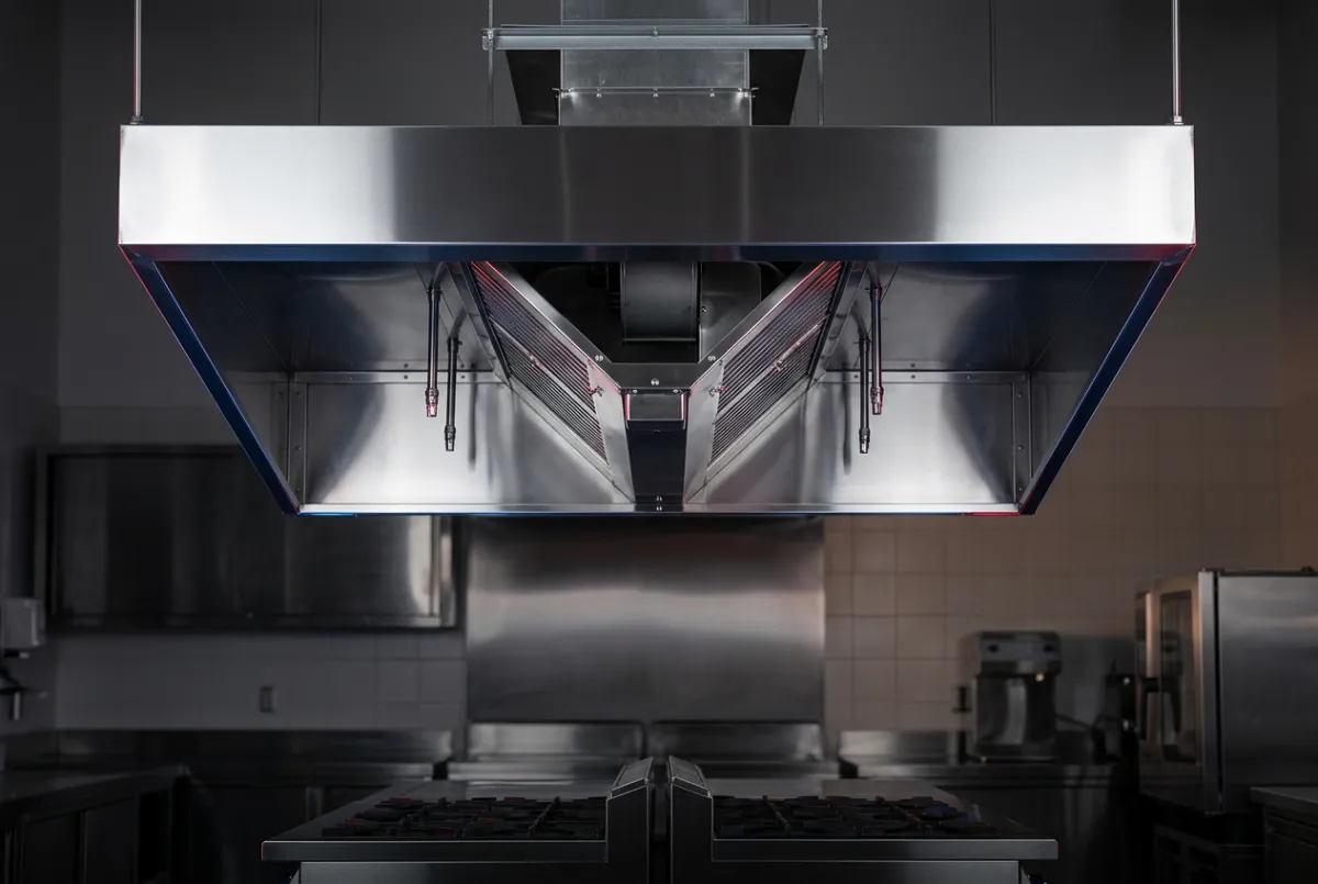 Commercial kitchen canopy hood scraped to bare metal