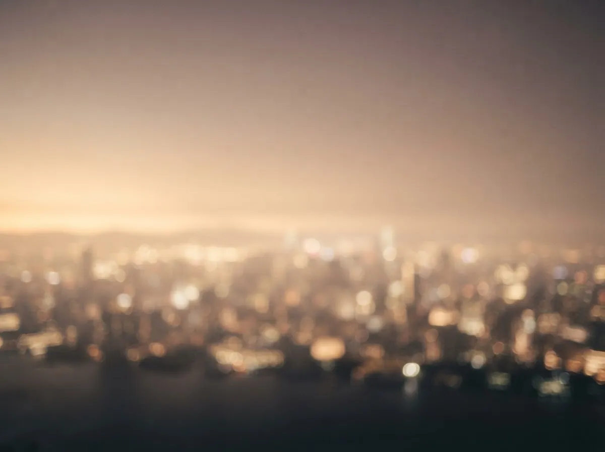 Abstract city-wellness haze—soft skyline light gradient with warm neutral tones (no people).