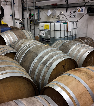 Stacked whisky casks in warehouse
