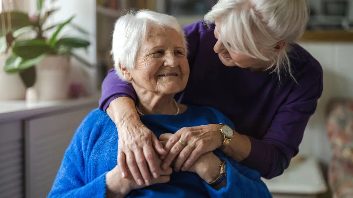 Two older women smiling together