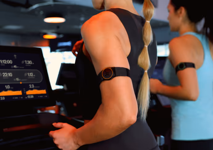 Person wearing performance tracker while running