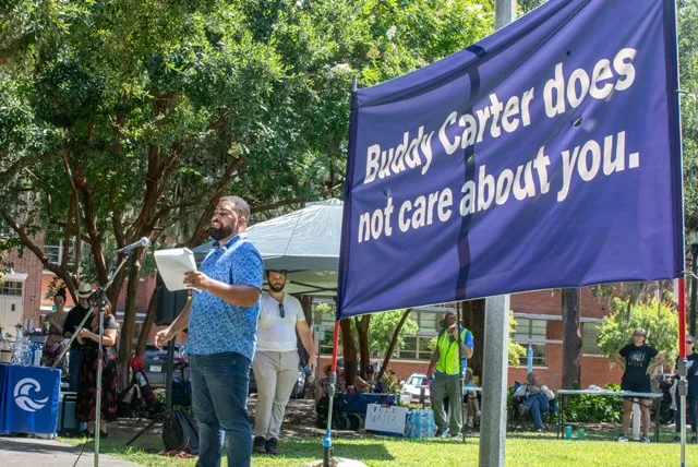 Corey Foreman speaking at an outdoor event