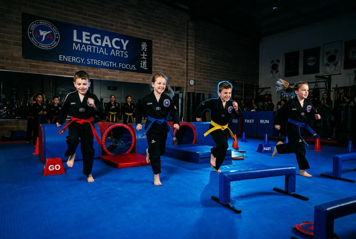 Karate kids running high energy obstacle course ninja training games