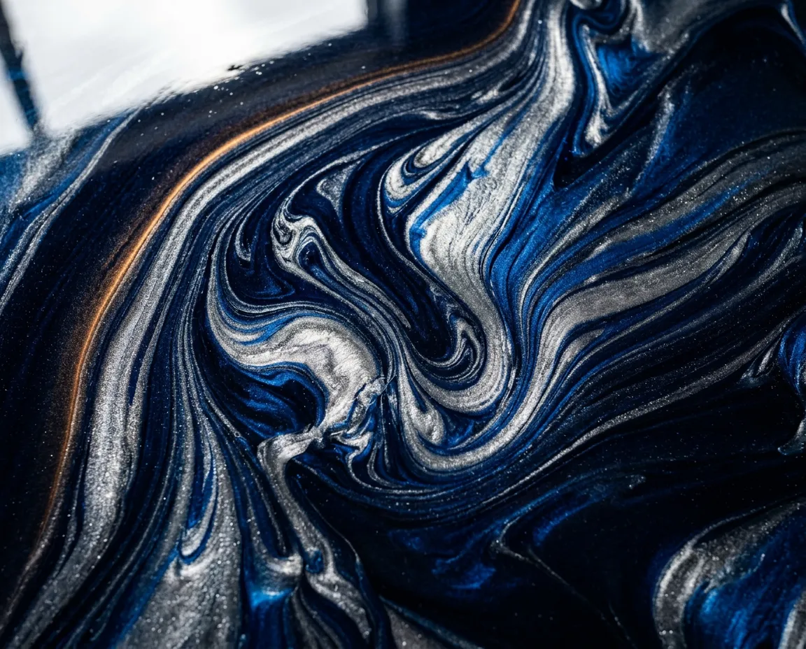 High detail macro view of deep 100 percent solids metallic epoxy floor coating showing dimensional marbling and thick clear resin finish