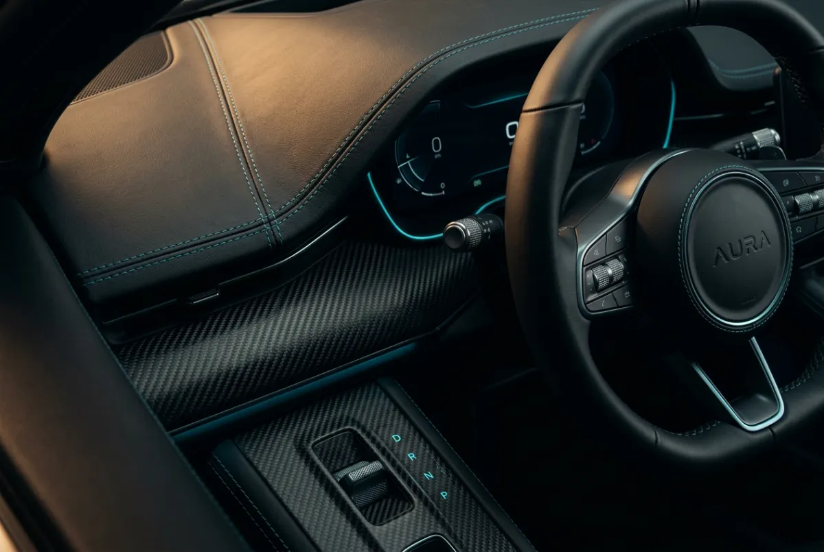 Pristine luxury automotive cockpit detailing showing matte leather and carbon fiber textures