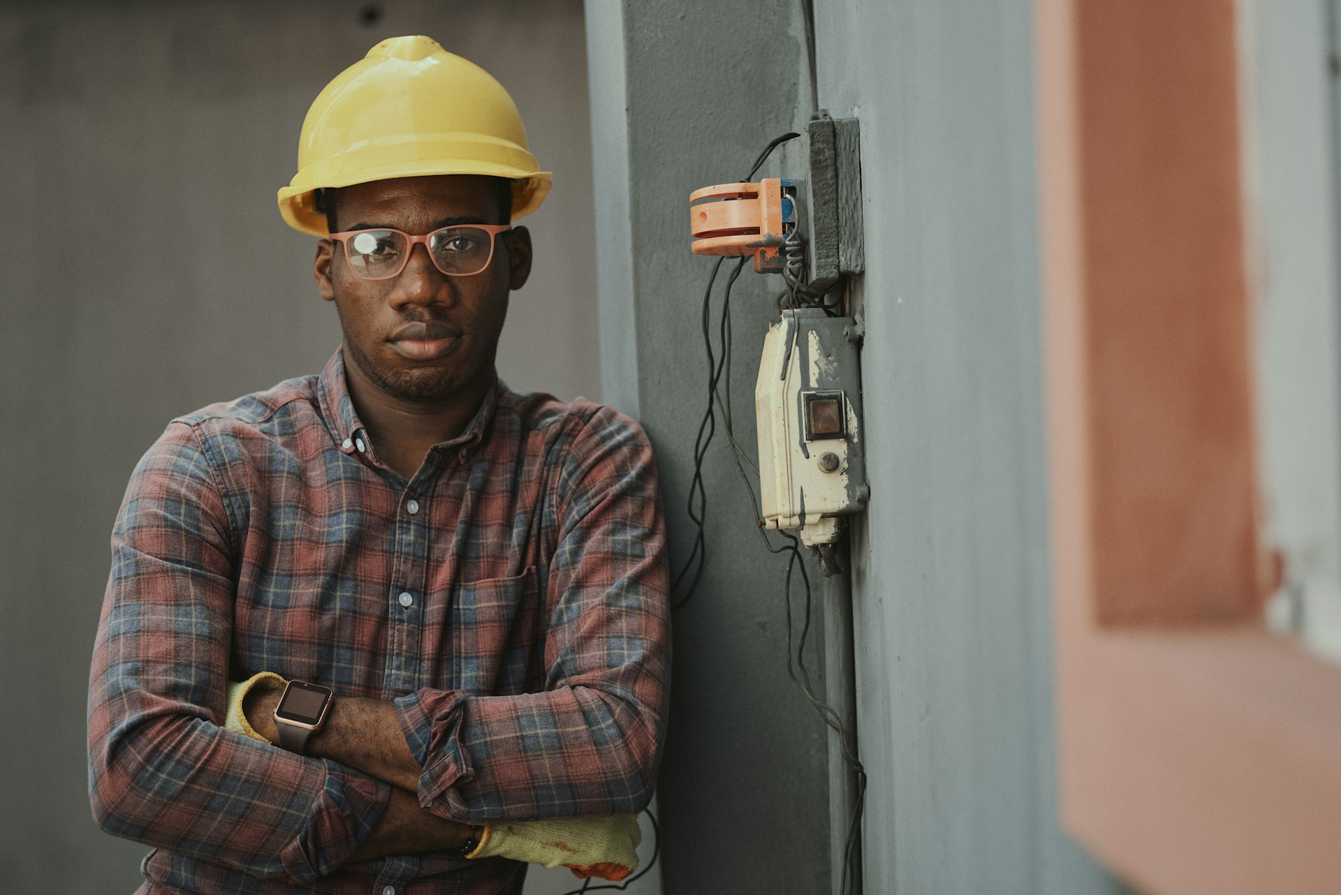 Electrician on jobsite performing electrical services