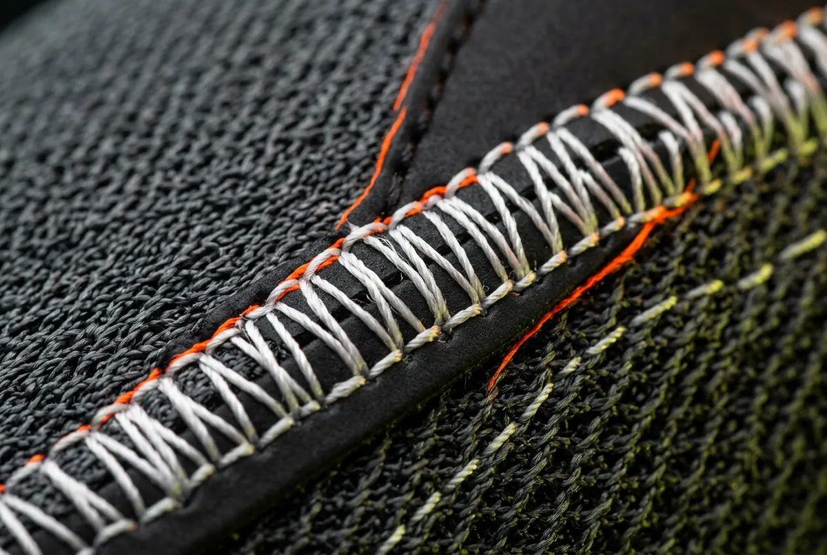Macro lens view of sneaker stitching precision and thread count