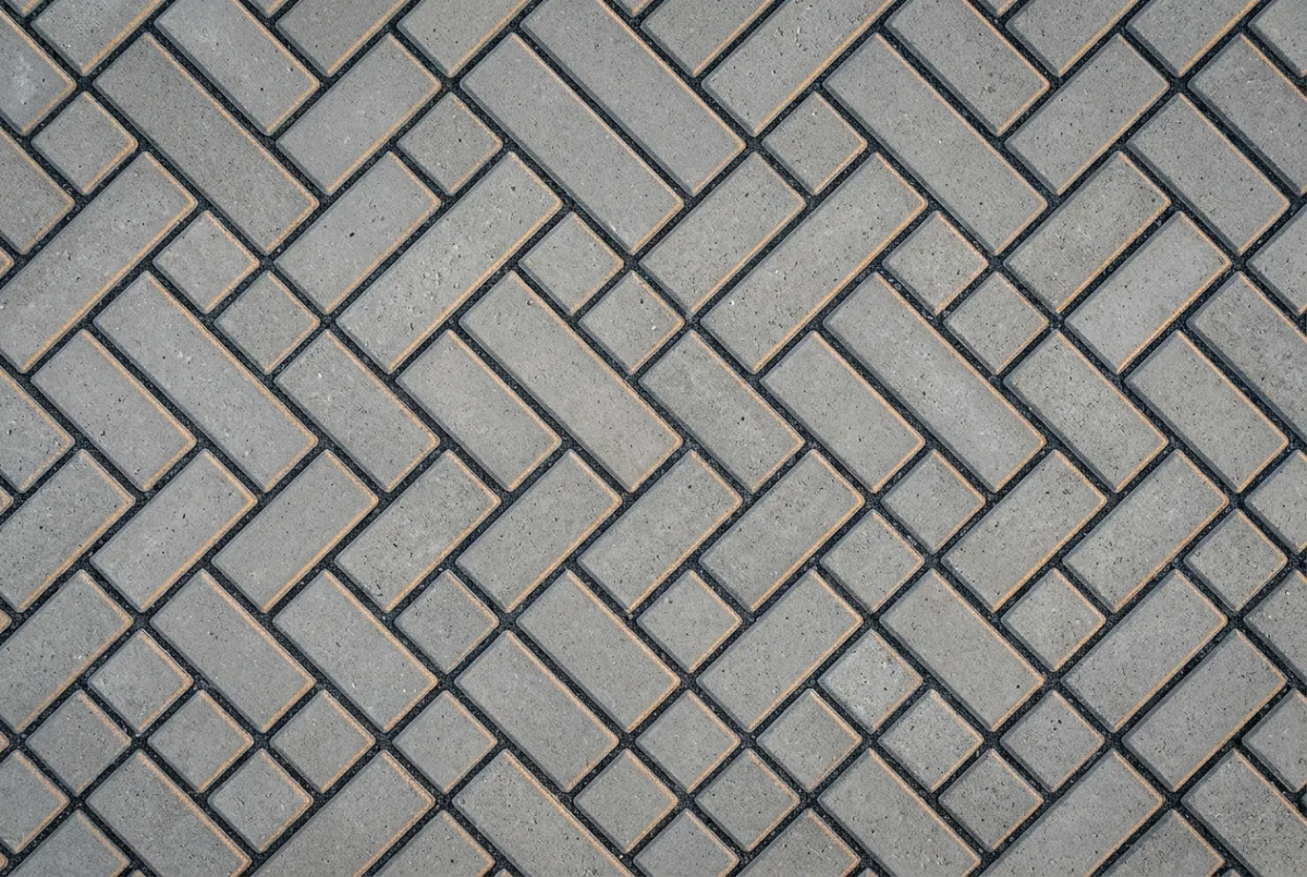 Macro texture of precision interlocking concrete block paving laid in 45 degree herringbone bond