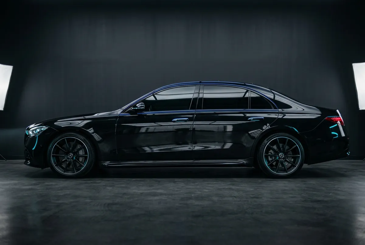Ceramic coating application on luxury vehicle in Tampa detailing studio
