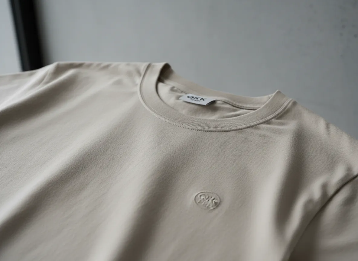 Close-up of QKK PEP tee detail