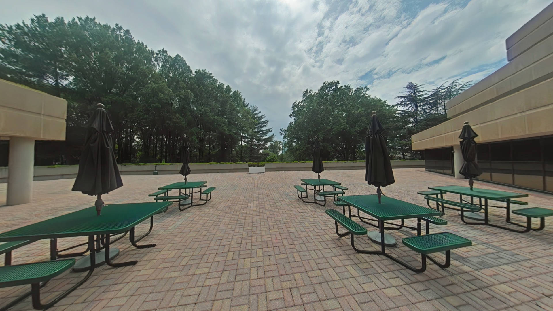 Outdoor cafeteria patio with picnic tables