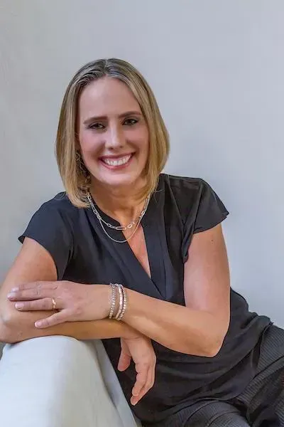 Smiling woman in black top
