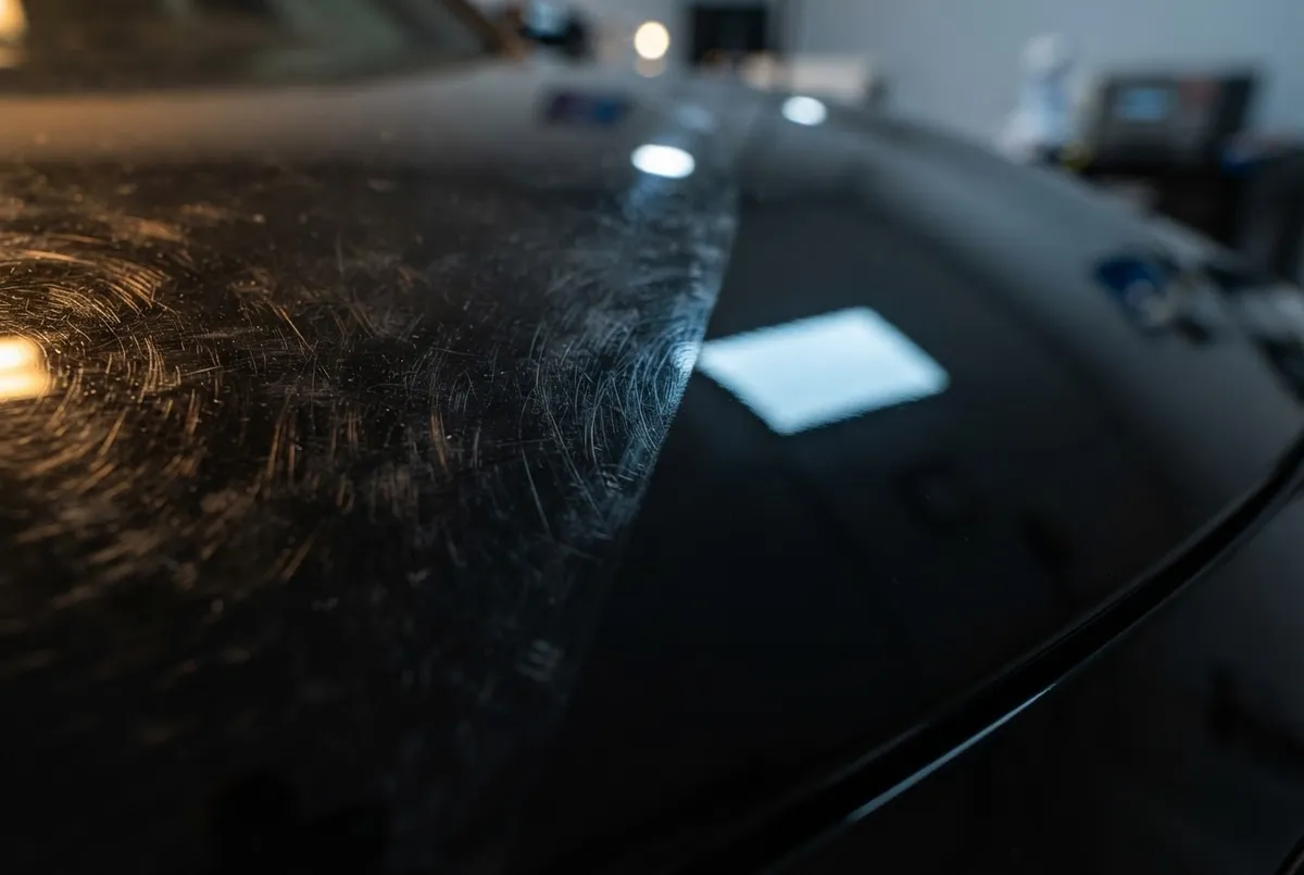 Macro view of self-healing thermopolymer film eliminating surface swirl marks