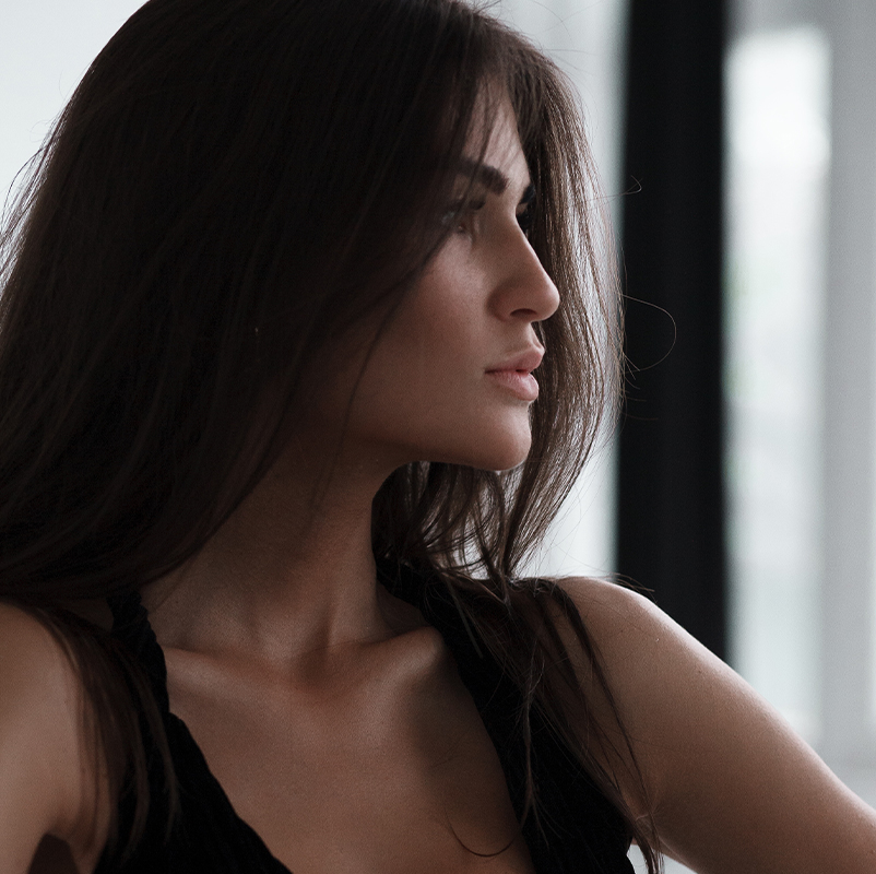 Woman smiling looking sideways