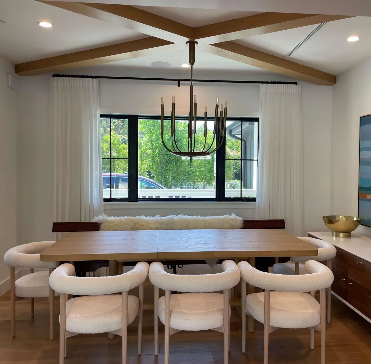 Elegant living room featuring custom furniture and window treatments, showcasing superior craftsmanship and personalized design for a stylish and comfortable home.