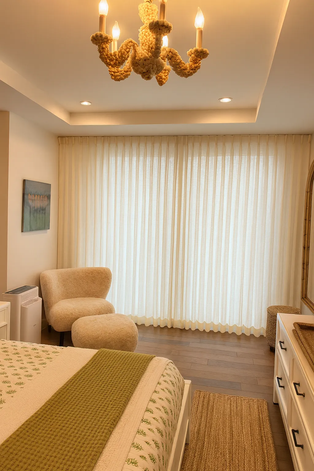 Soft sheer drapery in a serene bedroom with natural light and layered window treatments