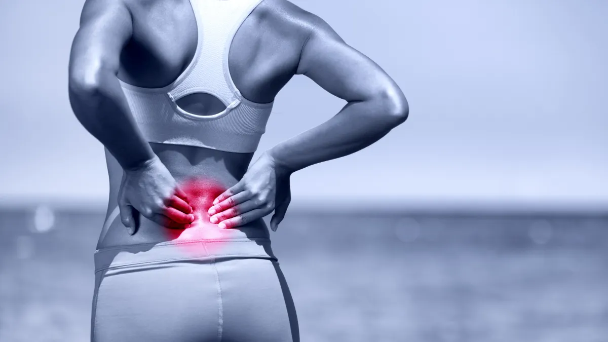 Lower back fluid build up spine clinic Lewisville TX