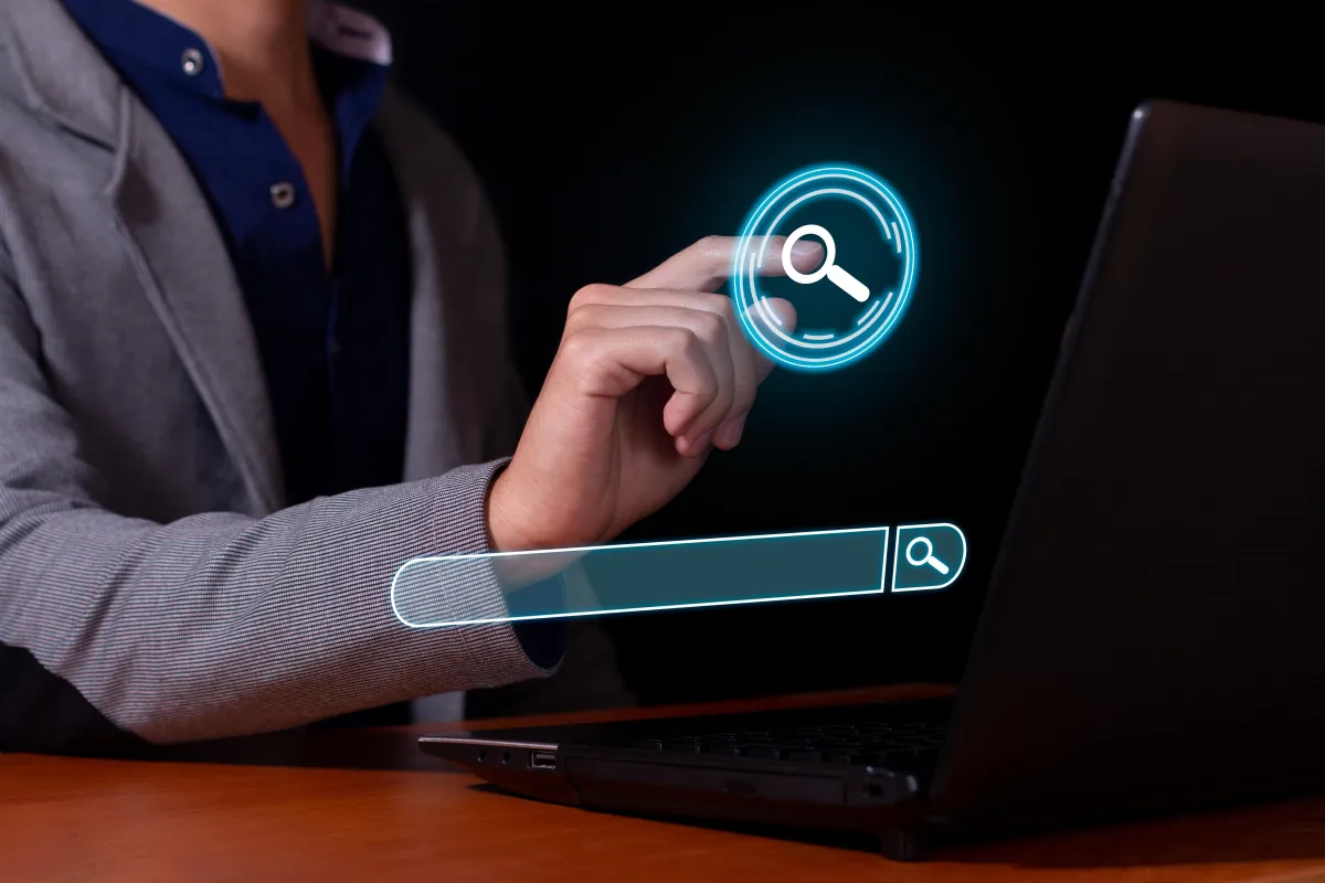 man typing keywords in a search engine