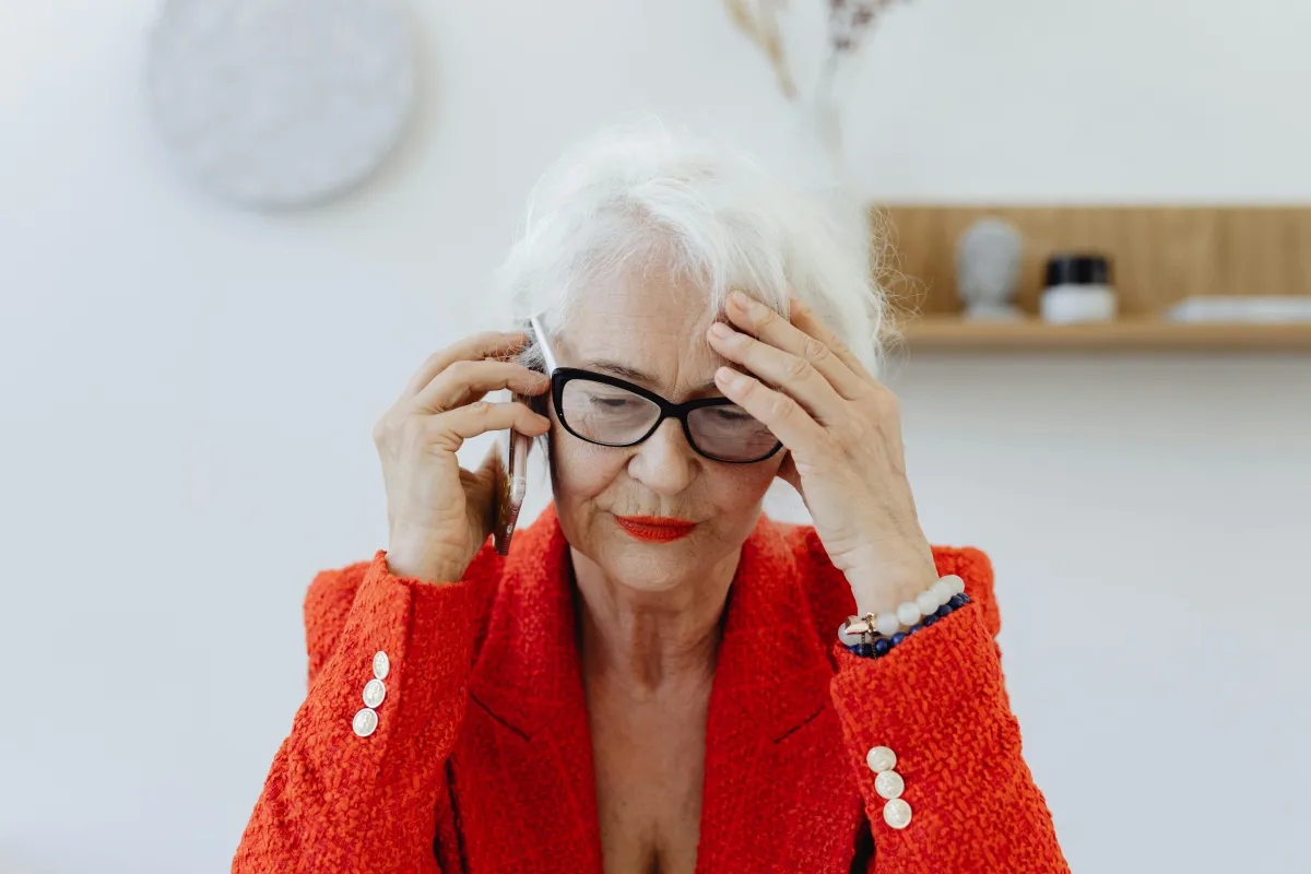 Stressed woman on a phone call.