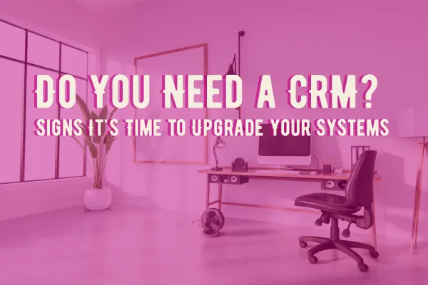 Do you need a CRM? Pink home office with text overlay about signs it’s time to upgrade your client systems.