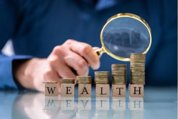 men holding a looking glass to inspect his wealth represented by building stacks