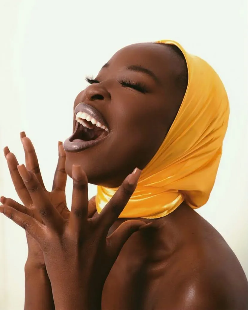 Black woman laughing Confidently