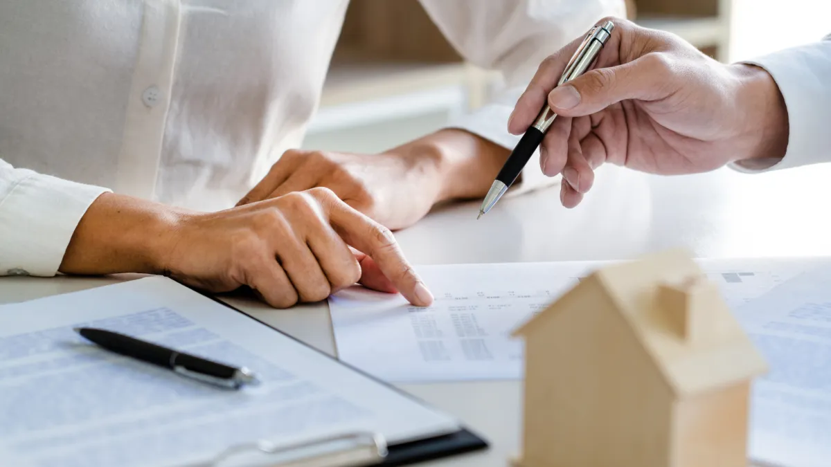S Corporation owner signing home rental agreement