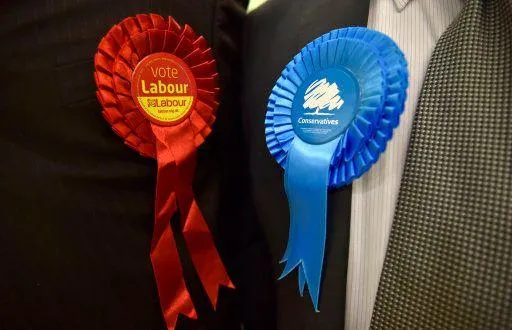 Red Labour and Blue Conservative Rosettes