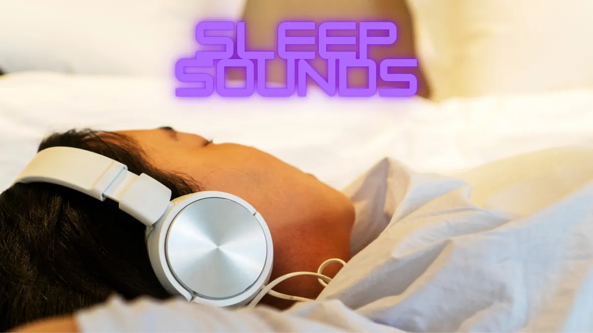 a person laying in bed with headphones on