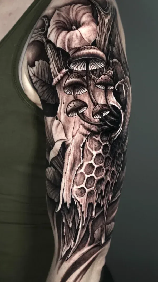 skull and honeycome and mushroom mishmash black and grey surrealism tattoo: Professional tattoo by James Strickland at Montana Tattoo Company in Missoula, MT 