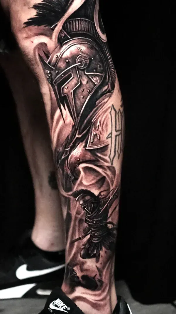 Spartan Leg black and grey surrealism tattoo: Professional tattoo by James Strickland at Montana Tattoo Company in Missoula, MT 