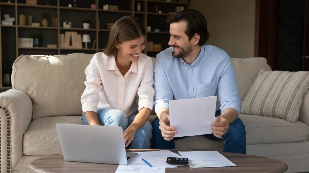 Happy Mildura couple reviewing home maintenance costs, including professional gutter cleaning services"  Let me know if you’d like a more SEO-heavy version or a version focused on emotion or relatability