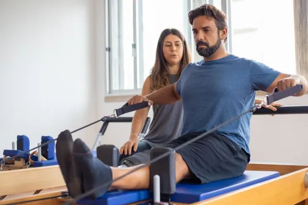 a man exercising under supervision