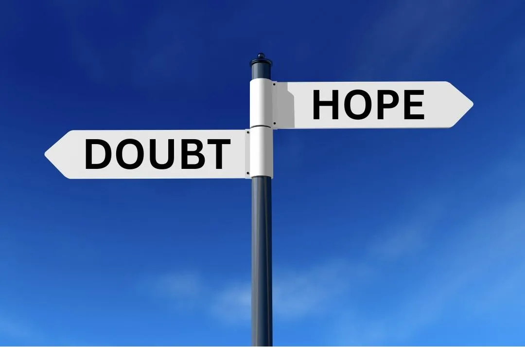 Signpost with the word doubt pointing west and hope pointing east