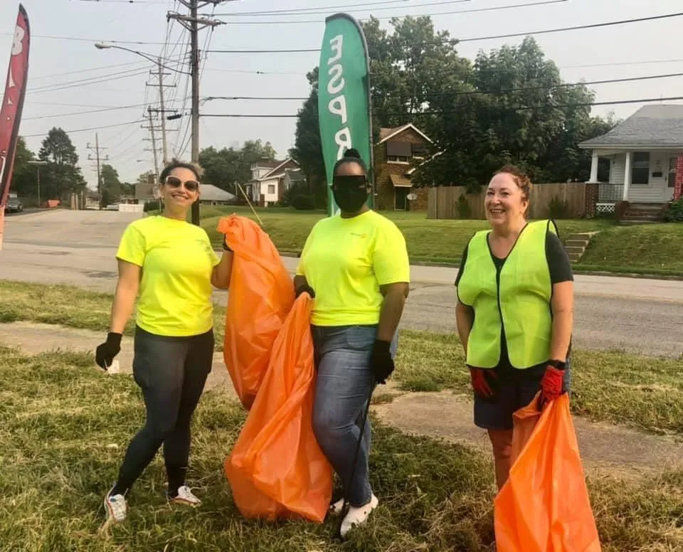 Enthusiastic Riverbend Rotary Club presidents participating in the Alton City Wide Litter Cleanup, working together to keep the city clean and beautiful