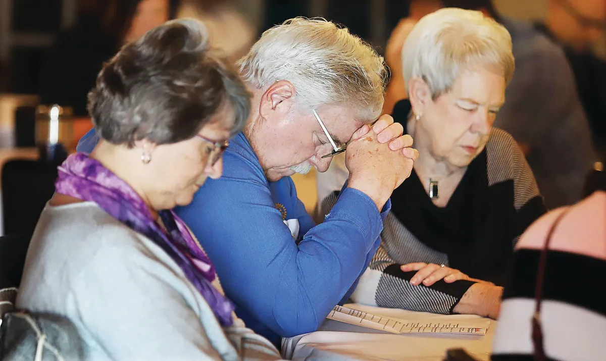 "Local residents bow their heads in prayer at the National Day of Prayer observance event hosted by Riverbend Rotary. It's heartwarming to see people from different backgrounds and beliefs come together to pray for the well-being of their community, country, and the world. Their sincere and solemn expressions reflect the power and importance of faith in our lives. May their prayers be heard and answered." #NationalDayofPrayer #CommunityPrayer #FaithUnitesUs Photos by John Badman | The Telegraph