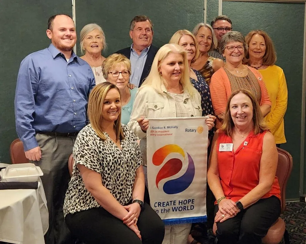Riverbend Rotarians pose at changeover ceremony