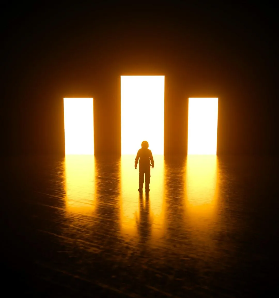 A person standing boldly in open space with light radiating around them, symbolizing freedom from inner conditioning.