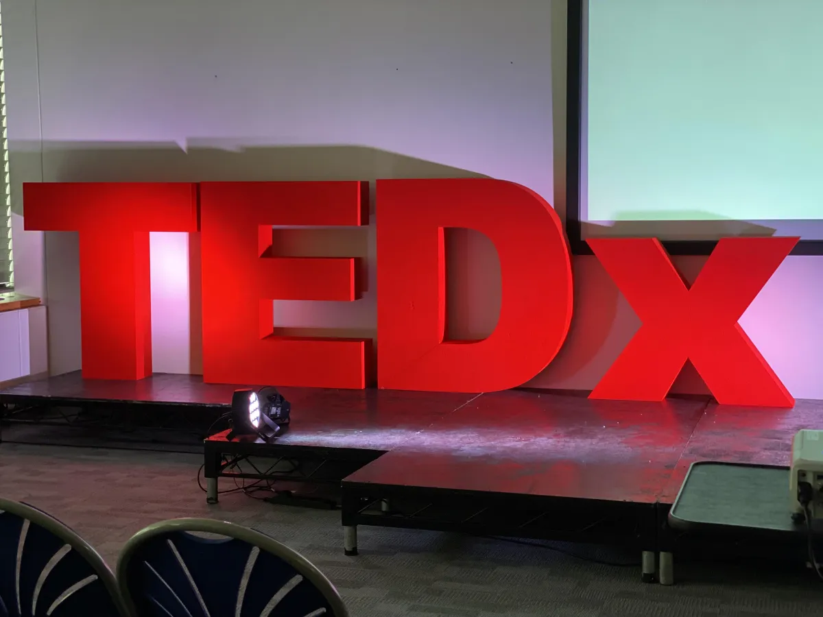 TEDx sign on a stage