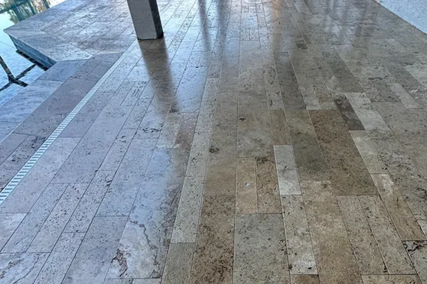 Expert application of colored concrete sealers on a driveway in Palm Coast, FL by ReFine Pressure Washing and Exteriors