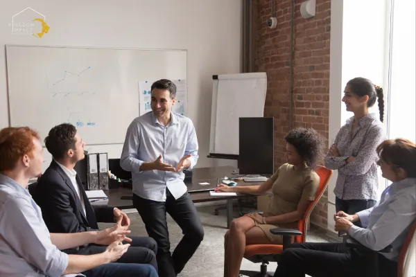 Confident business coach and diverse company employees at training