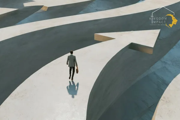 Man walking through giant concrete arrow structures choosing direction representing decision making and career choices