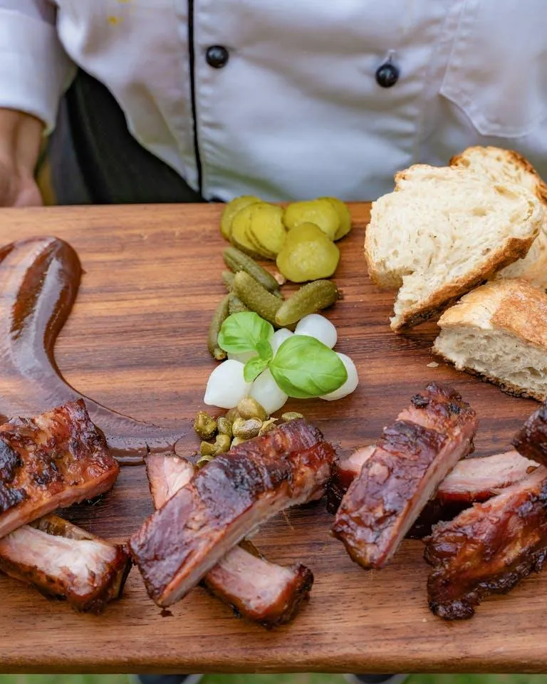 The History of BBQ: From Ancient Times to Modern Pits – A Flavorful Journey with Blvd Bar BQ & Wings

