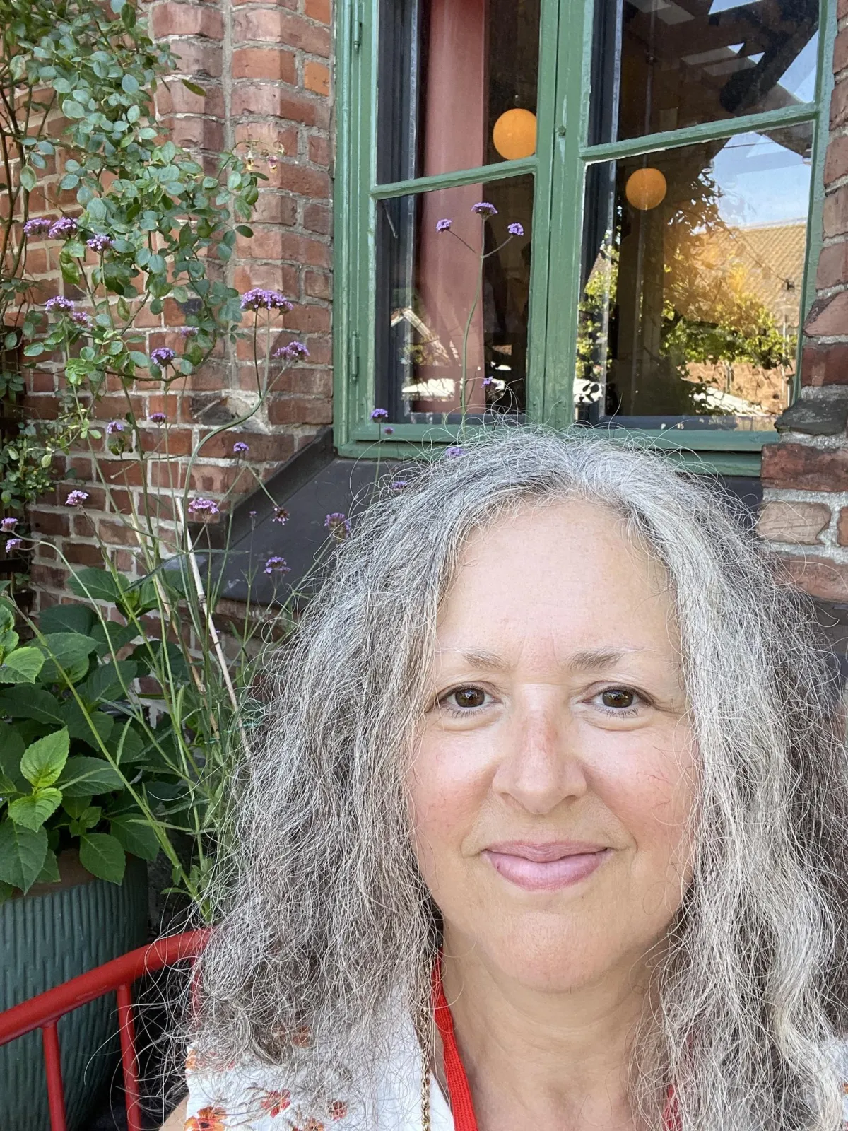 Miriam Segal sitting outside in a garden